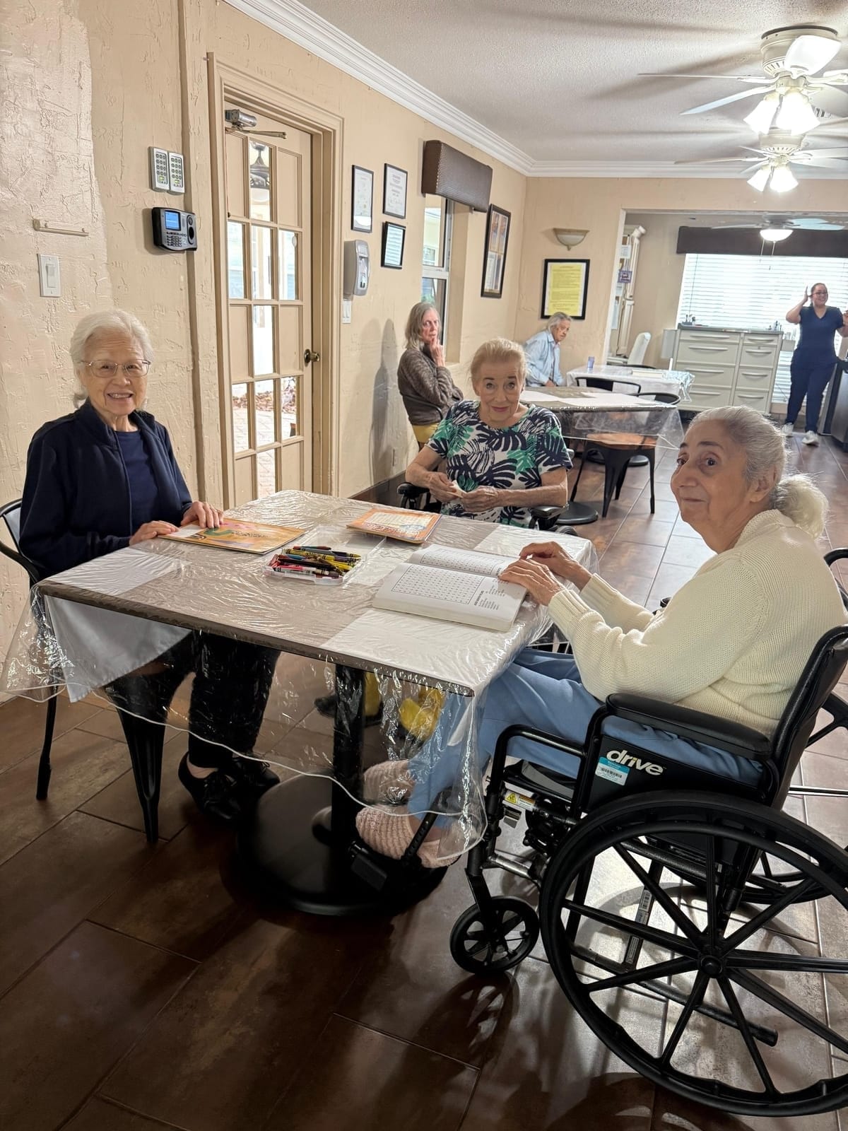 Residents sharing a common-room afternoon at Royal Palm Senior Residence.